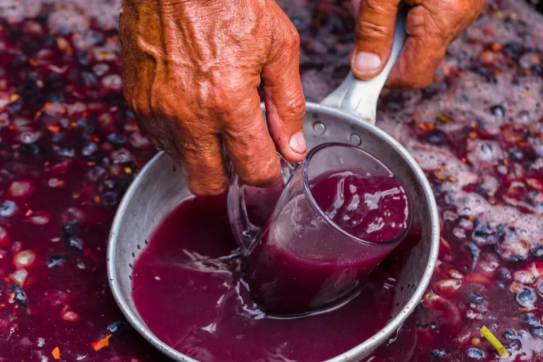 Red wine ferments with its skins, extracting colour, tannin, and flavour from dark grape varieties such as Cabernet Sauvignon, Merlot, and Pinot Noir.