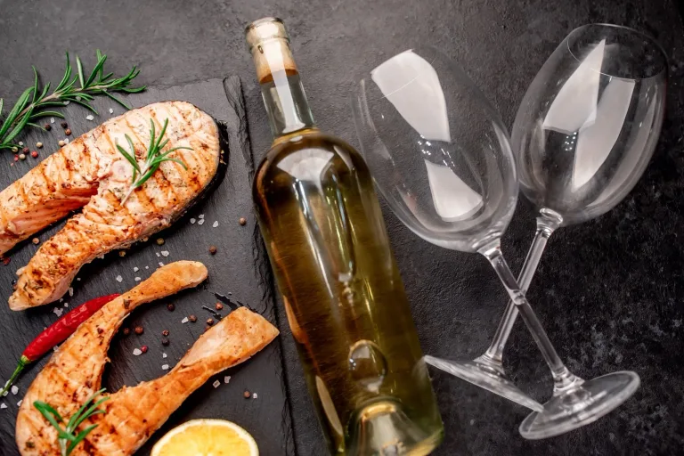 Fatty fish like salmon or toro find perfect balance with fuller whites or light, silky reds that refresh the palate and complement their rich texture.